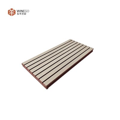 Stylish Acoustic Treatment With Grooved Wooden Panels For Modern Architecture