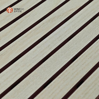 Stylish Acoustic Treatment With Grooved Wooden Panels For Modern Architecture